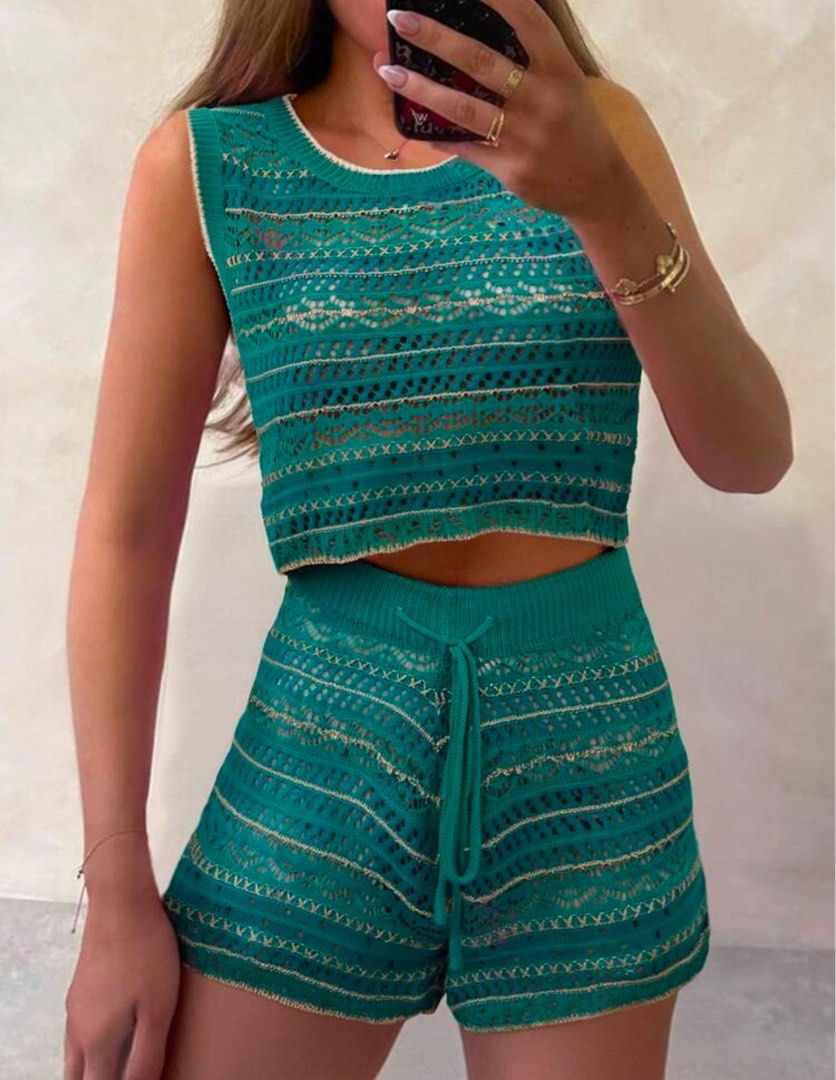 Women's Spring/Summer Knit 2-Piece Set (Category: Bikinis & Swimsuits) located in Pasig City. Submitted by Declutterwithme0831 (Listing ID 1436177260, Image 2). Description: - Two-piece set: sleeveless top and shorts - Made of knit fabric - Features a lace design - Shorts have a drawstring waist - Color: Green with gold accents - Ideal for casual summer wear or beach cover-up.