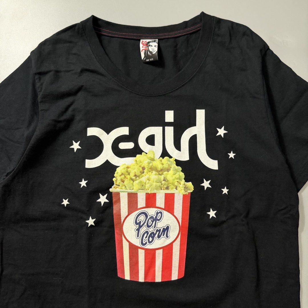 Y2K X-GIRL POPCORN TEE (Category: Tshirts & Polo Shirts ) located in Dagupan City. Submitted by dgp.plvg (Listing ID 1436144473, Image 2). Description: Y2K X-GIRL POPCORN TEE Size: One Size Width: 19” Length: 28” Condition: good as new Issues: none. .