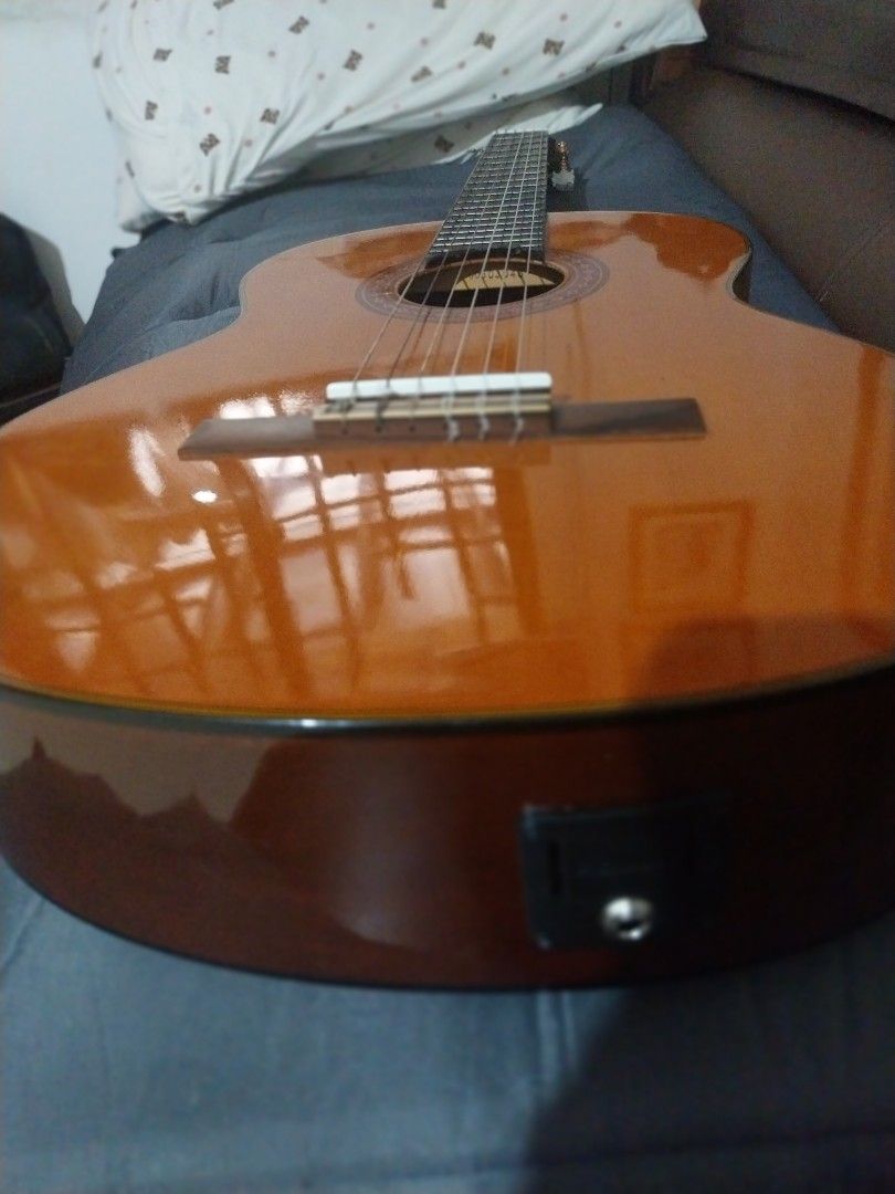 Yamaha C-70 Nylon Classic Guitar (Category: Musical Instruments) located in Cavite. Submitted by boldbird_5bb61a (Listing ID 1435106929, Image 3). Description: - Yamaha C-70 nylon string guitar -Fishman pickup - Classic design with a natural finish - Features a rosewood fingerboard - Spruce top - Well-maintained condition - Suitable for beginners and intermediate players - Includes the guitar only.