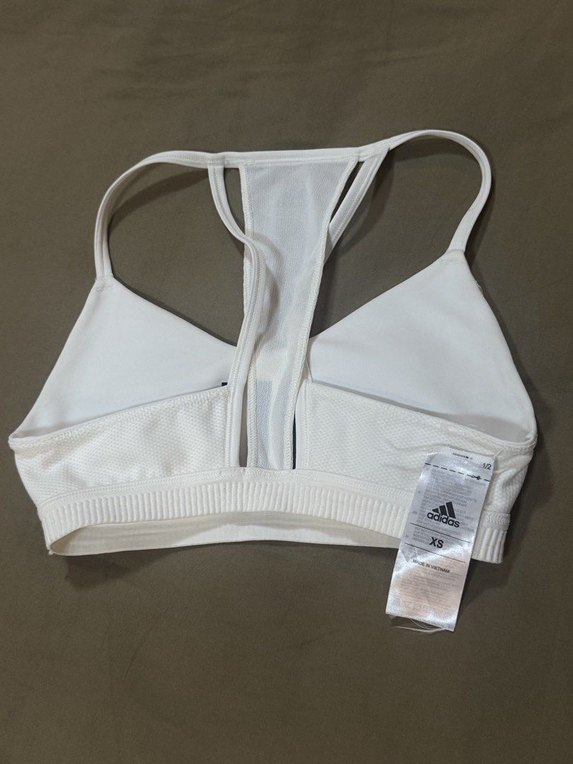 Adidas White Sports Bra (Category: Activewear) located in Masbate. Submitted by anjcbr (Listing ID 1436449593, Image 3). Description: - Adidas white sports bra - Has some minor discolorations - Loose tag - Slight color variations on the photo due to lighting.
