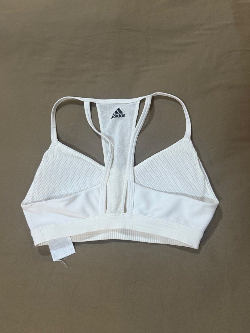Adidas White Sports Bra (Category: Activewear) located in Masbate. Submitted by anjcbr (Listing ID 1436449593, Image 2). Description: - Adidas white sports bra - Has some minor discolorations - Loose tag - Slight color variations on the photo due to lighting.