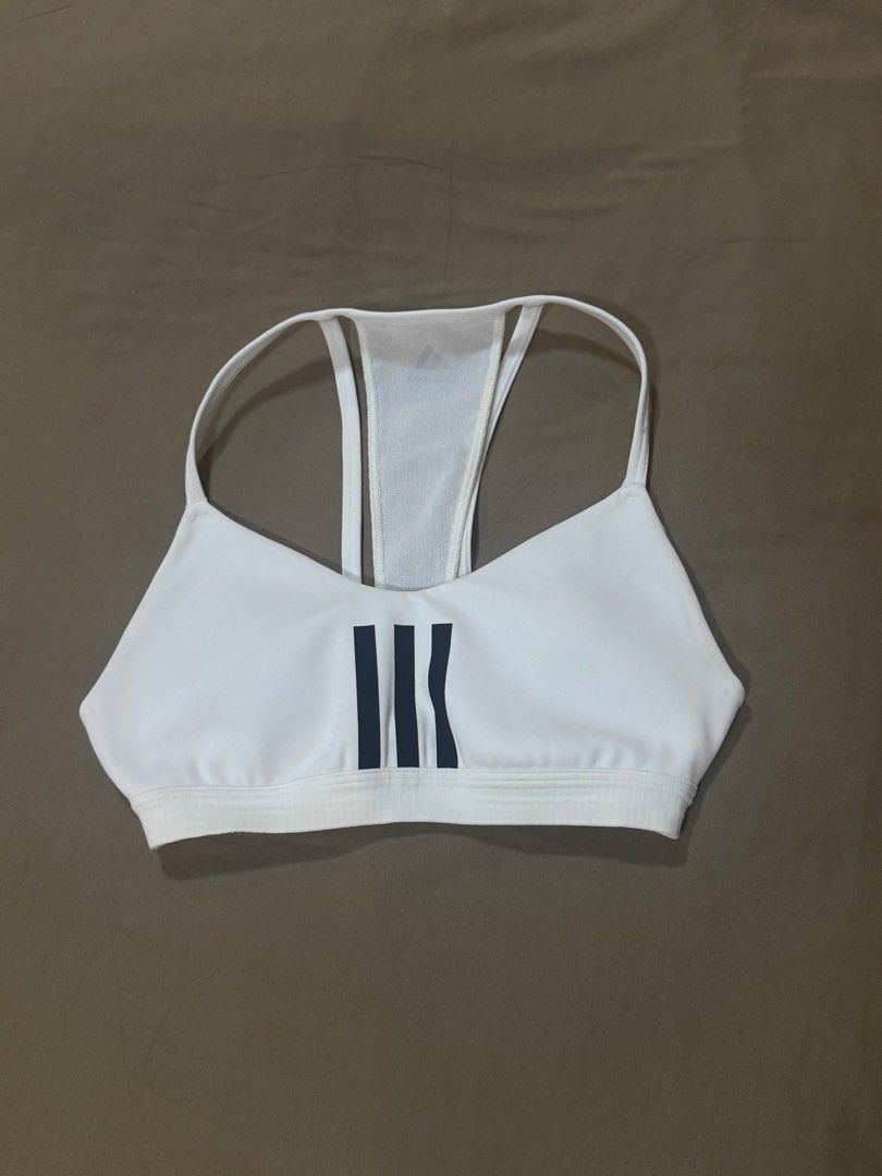 Adidas White Sports Bra (Category: Activewear) located in Masbate. Submitted by anjcbr (Listing ID 1436449593, Image 1). Description: - Adidas white sports bra - Has some minor discolorations - Loose tag - Slight color variations on the photo due to lighting.