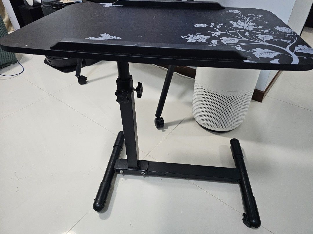 Adjustable and portable table