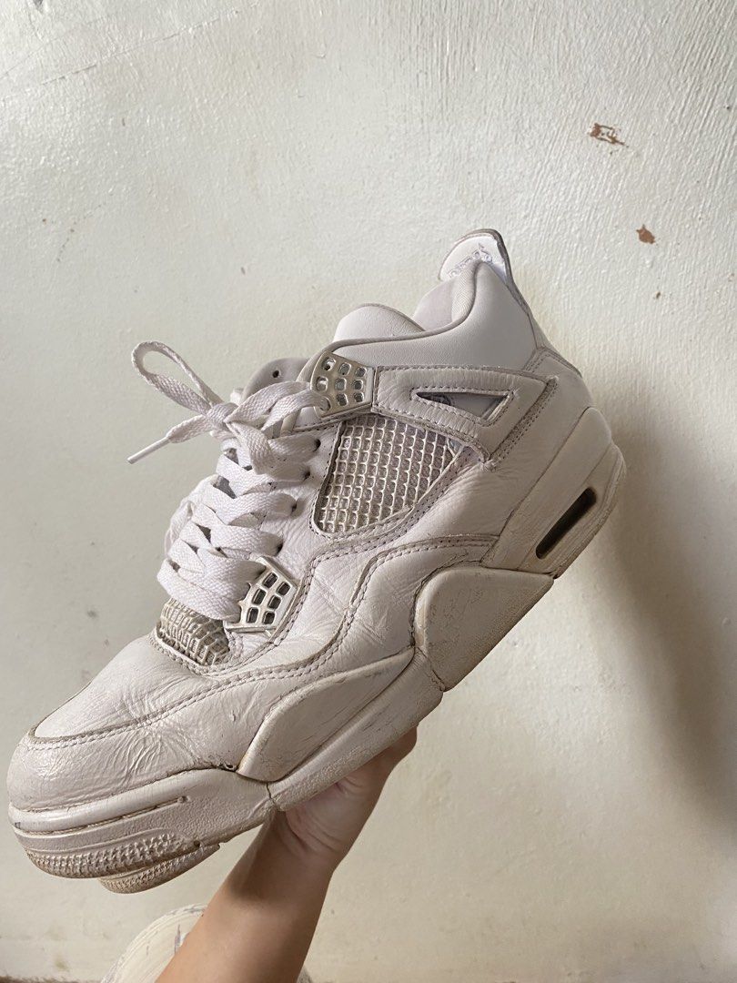 Air Jordan 4 White (Category: Sneakers) located in Baguio. Submitted by workwear2600 (Listing ID 1436424137, Image 1). Description: - White Air Jordan 4 sneakers - Iconic mesh netting detail - Visible Air unit in the heel - White laces and upper - Signs of wear on the leather.