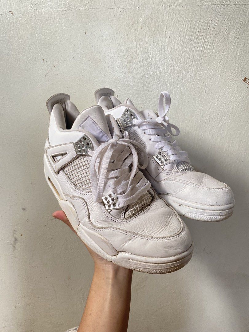 Air Jordan 4 White (Category: Sneakers) located in Baguio. Submitted by workwear2600 (Listing ID 1436424137, Image 3). Description: - White Air Jordan 4 sneakers - Iconic mesh netting detail - Visible Air unit in the heel - White laces and upper - Signs of wear on the leather.
