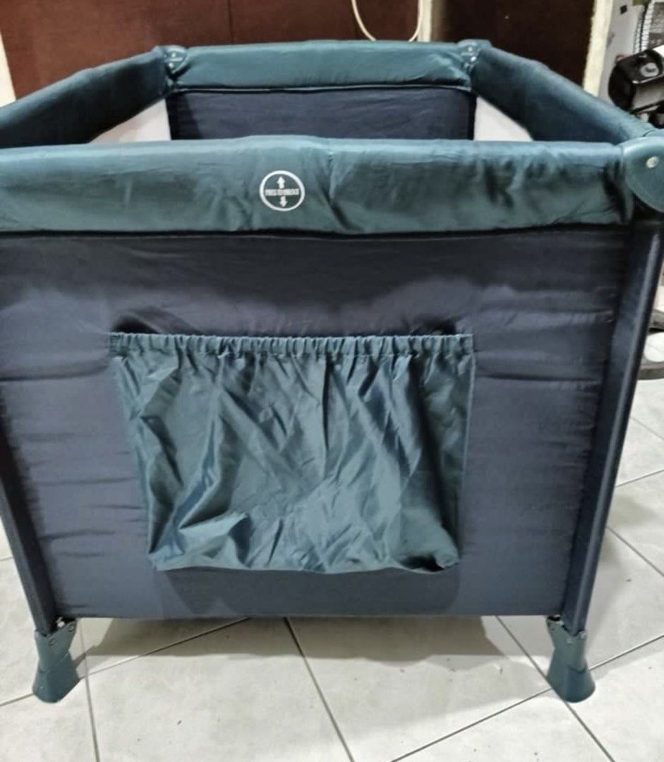 Akeeva Multifunctional Crib and playpen (Category: Cots & Cribs) located in Quezon City. Submitted by karlisleshop (Listing ID 1436298520, Image 3). Description: - Akeeva playard with Winter Jungle theme - Dark blue color - Mesh sides for visibility - Includes a canopy - Padded base for comfort - Features a storage pocket - Designed for babies and young children.