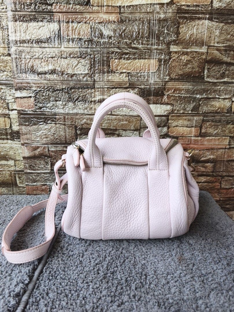 Alexander Wang Rookie Light Pink Two Way Bag (Category: Luxury Bags & Wallets) located in Taytay. Submitted by rgun28 (Listing ID 1436316619, Image 1). Description: FIXED PRICE!!! 2500 palugi na 🍀ALEXANDER WANG ROOKIE SLING BAG🍀 💯% guaranteed original 𝐂𝐨𝐧𝐝𝐢𝐭𝐢𝐨𝐧: In very good used condition/ Rank A-AB.. See photos to appreciate.. With cleanable dirt inside lining.. Money back guaranteed if proven fake by Entrupy. As is where is..NO RET