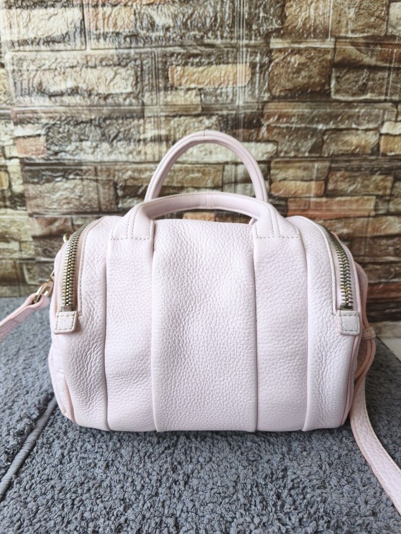 Alexander Wang Rookie Light Pink Two Way Bag (Category: Luxury Bags & Wallets) located in Taytay. Submitted by rgun28 (Listing ID 1436316619, Image 2). Description: FIXED PRICE!!! 2500 palugi na 🍀ALEXANDER WANG ROOKIE SLING BAG🍀 💯% guaranteed original 𝐂𝐨𝐧𝐝𝐢𝐭𝐢𝐨𝐧: In very good used condition/ Rank A-AB.. See photos to appreciate.. With cleanable dirt inside lining.. Money back guaranteed if proven fake by Entrupy. As is where is..NO RET
