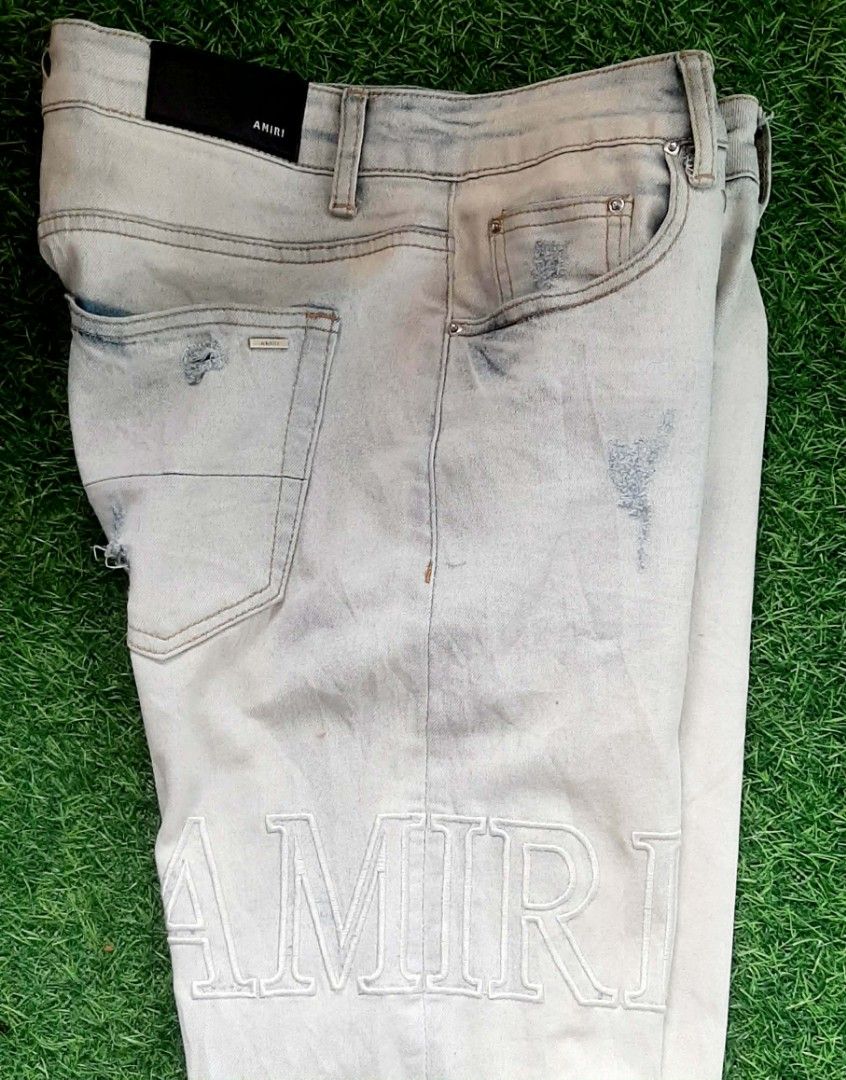 AMIRI LOGO DISTRESSED JEANS (Category: Jeans) located in Consolacion. Submitted by thriftnitata (Listing ID 1436320203, Image 3). Description: Brand : AMIRI Model : LOGO DISTRESSED, STRETCHABLE Color : Washed Blue Materials : 98 % cotton 2 % elastane Description : - waistline 32" on tag (will fit from 32"-34" actual) - Inseam length 29" - outseam length 39" - hem width 8" (straight fit) - LEGIT/OFF Condition : - 9/10 - used, 2nd hand Selling Pric