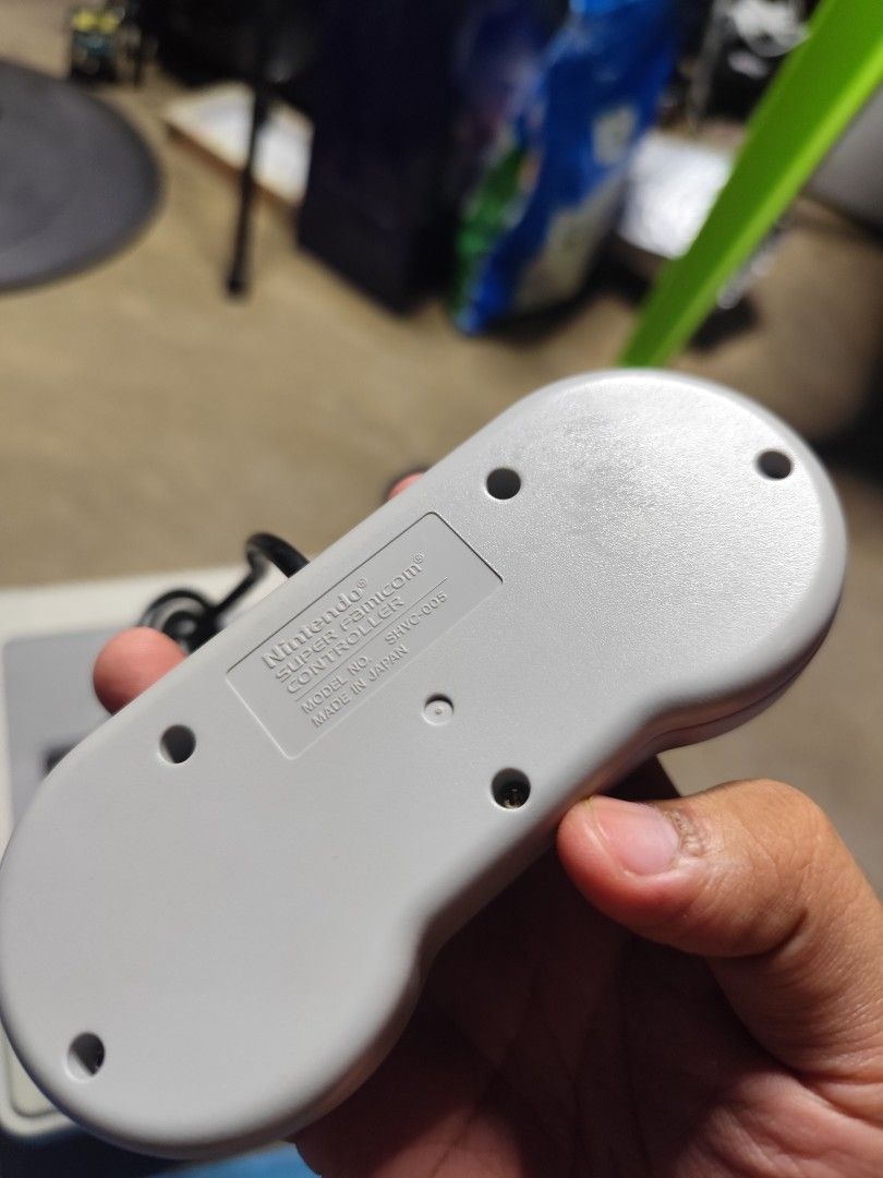 [AS-IS] Nintendo Super Famicom (Category: Nintendo) located in Binangonan. Submitted by r0nb1nt5cat5co (Listing ID 1436368177, Image 3). Description: Selling this AS-IS Condition, Nintendo Super Famicom. Already deep cleaned the console shell and controllers, I don't have the AC Apdater and AV Cables to test, also I UV Cured the crack on the back port just to add strong bond to the hard plastic. EDIT: Retrobright as possible..