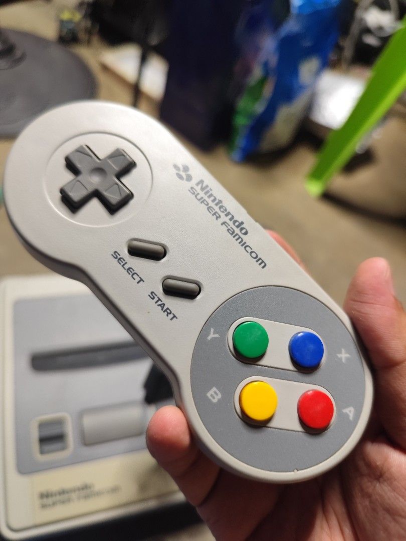 [AS-IS] Nintendo Super Famicom (Category: Nintendo) located in Binangonan. Submitted by r0nb1nt5cat5co (Listing ID 1436368177, Image 2). Description: Selling this AS-IS Condition, Nintendo Super Famicom. Already deep cleaned the console shell and controllers, I don't have the AC Apdater and AV Cables to test, also I UV Cured the crack on the back port just to add strong bond to the hard plastic. EDIT: Retrobright as possible..