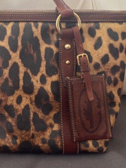 Authentic Dolce & Gabbana Leopard Leather Bag (Category: Luxury Bags & Wallets) located in Bacoor. Submitted by clothestodeclutter (Listing ID 1436296166, Image 2). Description: - Brand: [Dolce & Gabanna] - Color: [Brown/Leopard Prints] - Stylish design - Durable material (Made with leather).