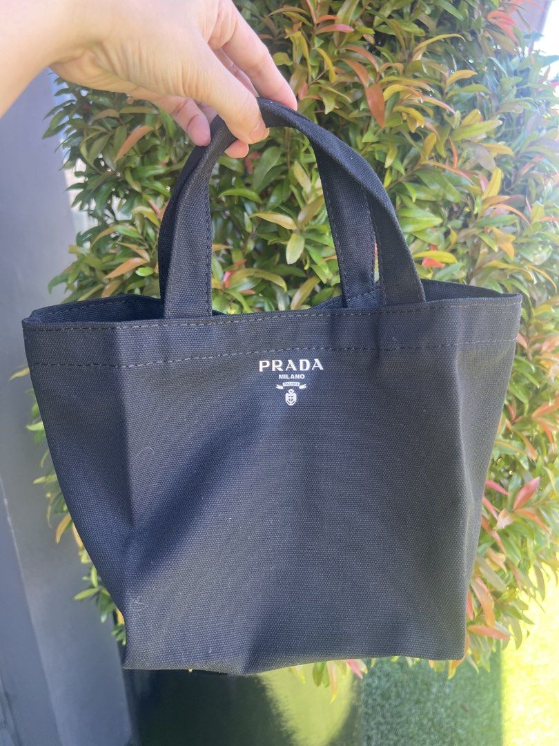 Authentic Prada hand bag gift from store purchase (Category: Luxury Bags & Wallets) located in Quezon City. Submitted by DZignersbyZsa (Listing ID 1436295378, Image 1). Description: Authentic Prada gift from store purchase Hand bag. velcro closure new/unused comes in black & red color .