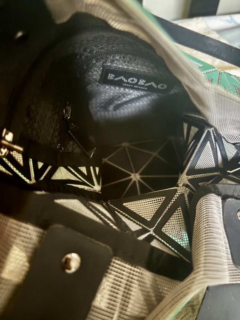 Bao Bao Issey Miyake Tote Bag (Category: Luxury Apparel) located in Dinalupihan. Submitted by pinkshop21 (Listing ID 1436323113, Image 3). Description: -Issey Miyake Bao Bao tote bag - Color: Green - Geometric design - Black handles and interior lining - Zippered interior pocket - Brand name visible inside.