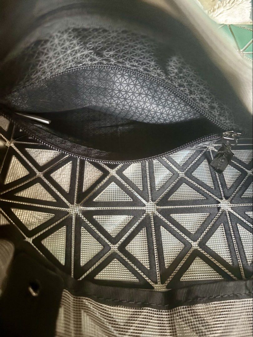 Bao Bao Issey Miyake Tote Bag (Category: Luxury Apparel) located in Dinalupihan. Submitted by pinkshop21 (Listing ID 1436323113, Image 2). Description: -Issey Miyake Bao Bao tote bag - Color: Green - Geometric design - Black handles and interior lining - Zippered interior pocket - Brand name visible inside.