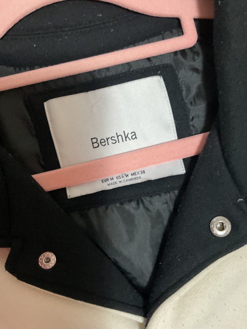 Bershka Varsity Jacket (Category: Coats, Jackets and Outerwear) located in Quezon City. Submitted by prelovedbykhy (Listing ID 1436398064, Image 3). Description: - Bershka varsity jacket - Black and white color block design - Size M - "New Wave" emblem on the back - "DAA" embroidery - Button-up front - Striped cuffs.