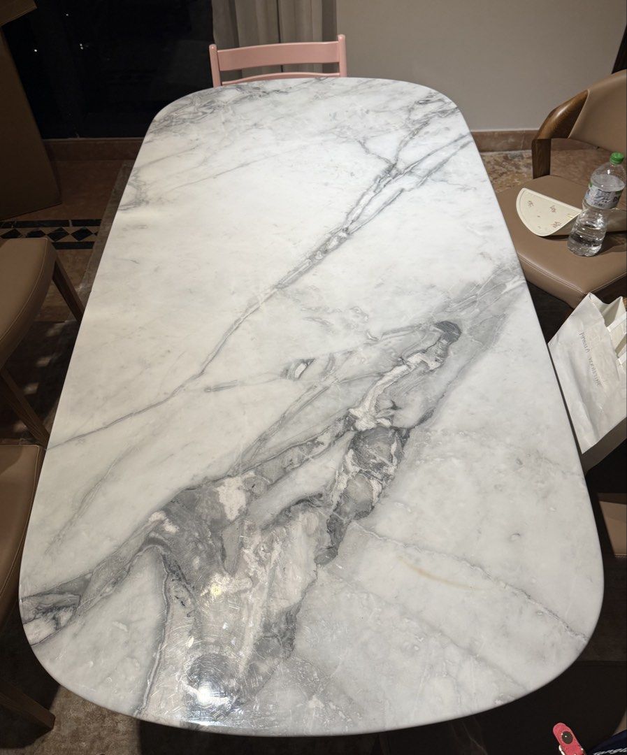 Marble Table (Category: Tables & Sets) located in Singapore. Submitted by ameliakne (Listing ID 1436423463, Image 2). Description: Bought $2580 from Star Living 6 months ago “MONTINI Bespoke dining table”. With invoice. - L 1800 x W 950 x H 760 mm (Calacatta Natural Marble) - must be picked it May 27th or May 28th - has a small chip ( see photo) .