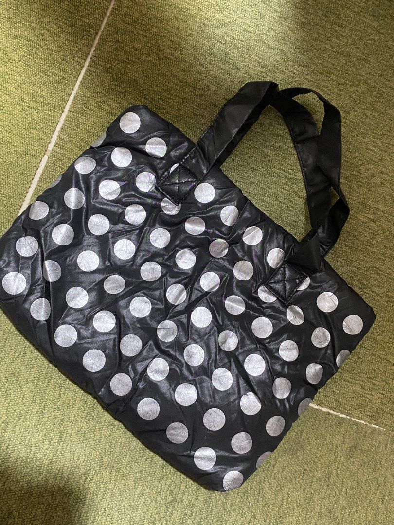 Black and Silver Polka Dot Bag Bubble bag (Category: Tote Bags) located in Manila. Submitted by faerikhae (Listing ID 1436440512, Image 3). Description: - Black tote bag short handle - Silver polka dot design - Two handles - Magnetic snap closure - Black interior - Small logo detail - Shiny, possibly nylon-like material.
