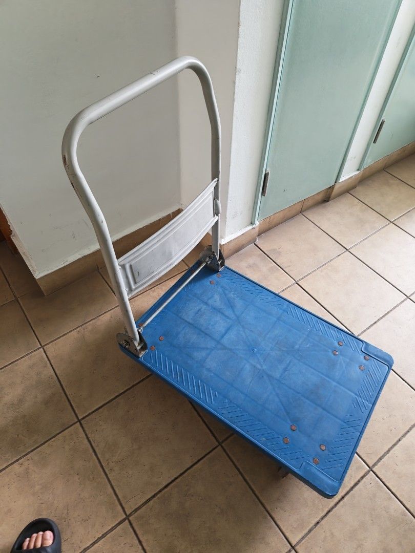 Blue Plastic Platform trolley with Wheels (Category: Everything Else) located in Singapore. Submitted by bestvalueclearance (Listing ID 1436320028, Image 2). Description: - Blue plastic platform dolly - Durable construction - Ideal for moving boxes, furniture, and other heavy items - Four wheels - Suitable for home or office use 200kg.