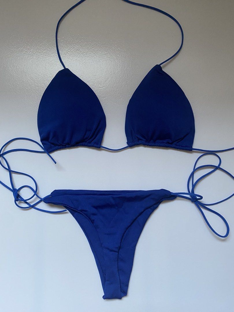 Blue Triangle Bikini Set (Category: Bikinis & Swimsuits) located in Manila. Submitted by dodoheeee (Listing ID 1436354511, Image 2). Description: - Blue triangle bikini set - Features a halter top - String bottom for adjustable fit - Solid blue color - Ideal for beach or pool wear.