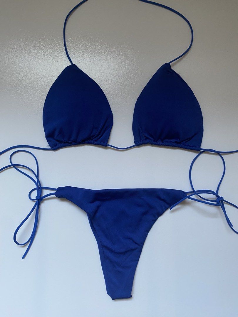 Blue Triangle Bikini Set (Category: Bikinis & Swimsuits) located in Manila. Submitted by dodoheeee (Listing ID 1436354511, Image 1). Description: - Blue triangle bikini set - Features a halter top - String bottom for adjustable fit - Solid blue color - Ideal for beach or pool wear.