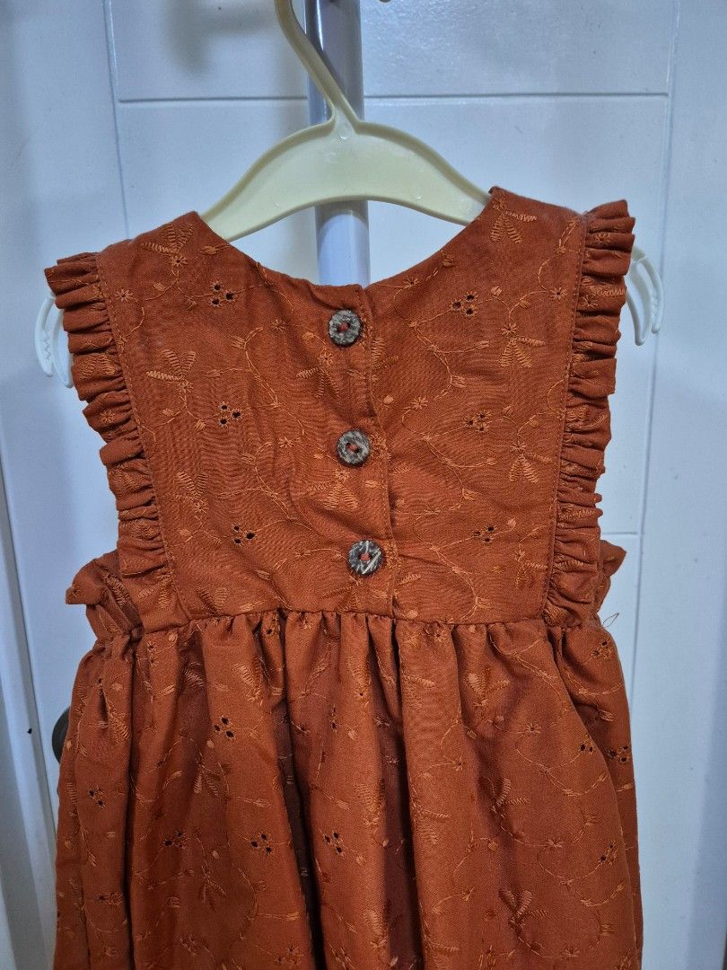 Rust Embroidered Dress with Buttons 3-4Y (Category: Babies & Kids Fashion) located in Bacoor. Submitted by amdeocampo (Listing ID 1436310278, Image 2). Description: - Littlestar Kids Rust dress with eyelet details - Round neckline with ruffle details - Three decorative buttons - Long sleeves - Gathered waist for a flowy fit - Perfect for casual wear or special occasions Pre-loved items, please manage your expectations. There may be slight discolo