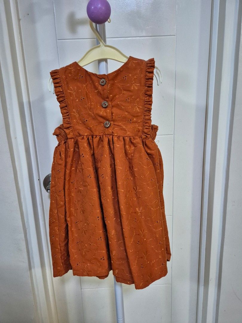 Rust Embroidered Dress with Buttons 3-4Y (Category: Babies & Kids Fashion) located in Bacoor. Submitted by amdeocampo (Listing ID 1436310278, Image 3). Description: - Littlestar Kids Rust dress with eyelet details - Round neckline with ruffle details - Three decorative buttons - Long sleeves - Gathered waist for a flowy fit - Perfect for casual wear or special occasions Pre-loved items, please manage your expectations. There may be slight discolo