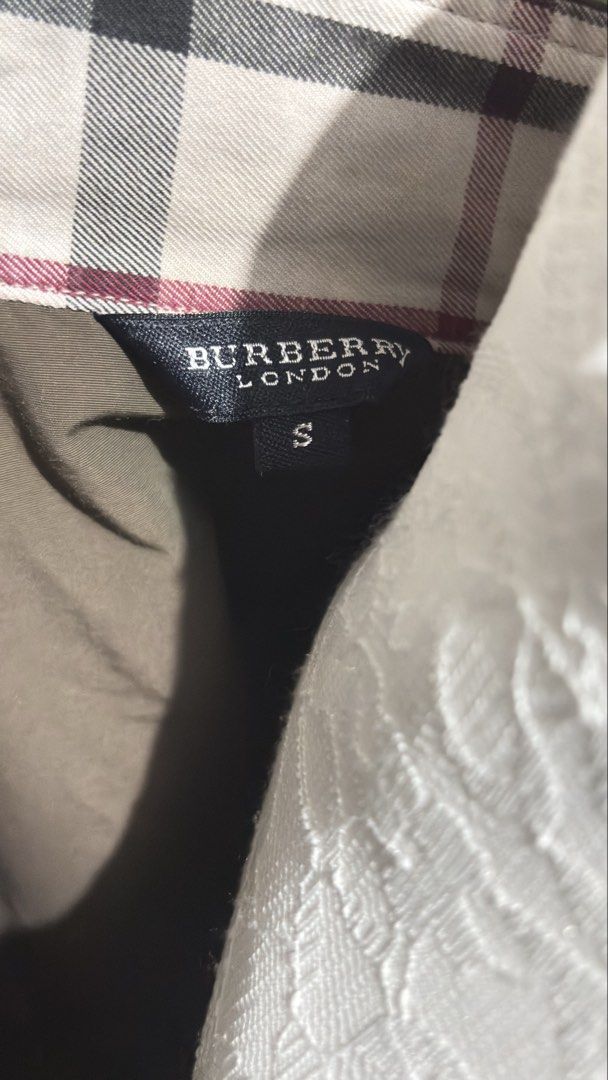 Burberry London Vest (Category: Others Tops) located in Cebu City. Submitted by cherrythrift_picks (Listing ID 1436388527, Image 3). Description: - Burberry London vest - Rich brown color - Small size - Collared design with button closures - Features Burberry logo - Check pattern on collar - 100% cotton lining - Perfect for layering.
