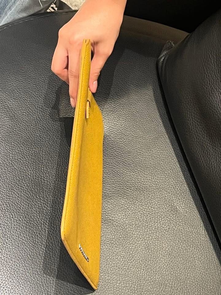 Burberry Tablet Sleeve (Category: Laptop Bags & Sleeves) located in Makati City. Submitted by aiahscloset (Listing ID 1436412981, Image 3). Description: - Genuine Burberry tablet sleeve - Mustard yellow color - Secure tab closure - Burberry logo detail - Crafted from leather - Designed for tablets.