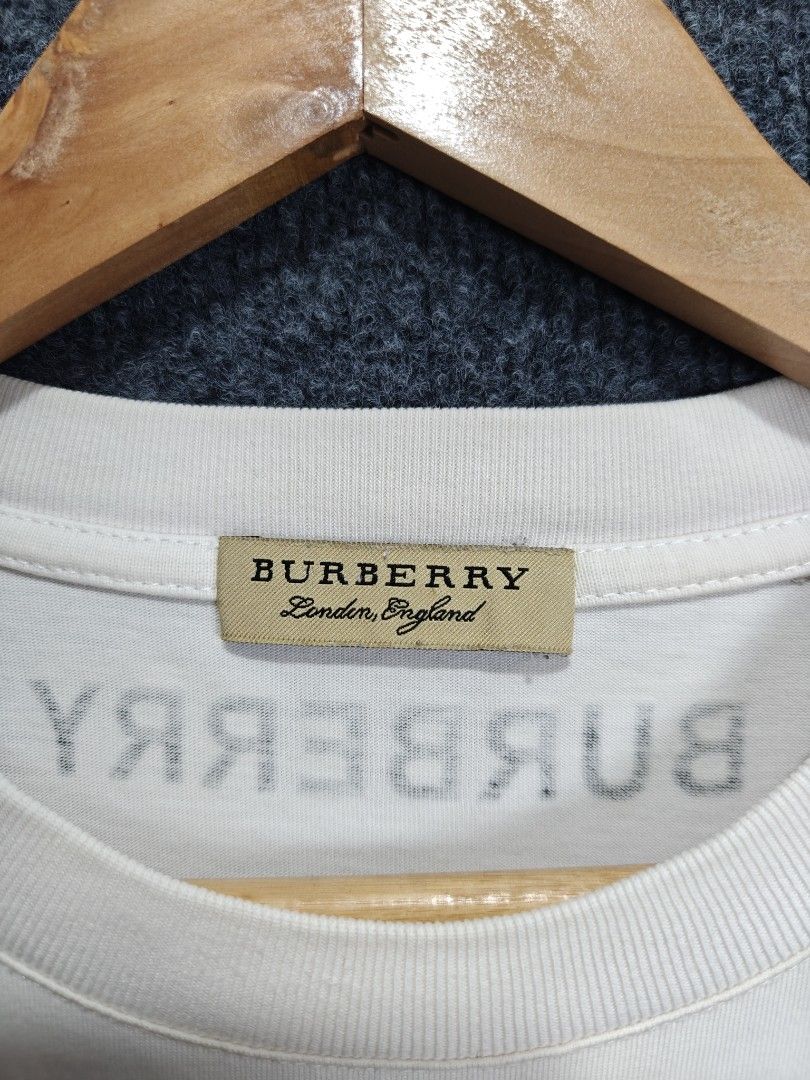 SALE ❗Burberry TB Logo T-shirt (Category: Tshirts & Polo Shirts ) located in Alaminos. Submitted by epargne (Listing ID 1436292037, Image 3). Description: 🏷️ Burberry TB Logo Condition: Vgood ! Color rate: 9/10 Size: Large - XL Measurement: ⬇️⬇️⬇️ Length' 29 'Width' 23.5 Issue: Dot stain see last photo. See picture for details ⬇️⬇️⬇️.