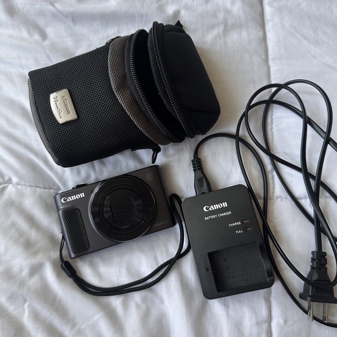 Canon PowerShot SX620 HS Digital Camera (Category: Cameras) located in Manila. Submitted by elaikaalm70490 (Listing ID 1436302378, Image 2). Description: - Canon PowerShot SX620 HS digital camera - 25x optical zoom - Includes: Canon battery charger, camera case, and wrist strap - Features a pop-up flash Issues: Lens not opening fully, but can manually open. Scratches seen on picture. Bought for 20,000 pesos.
