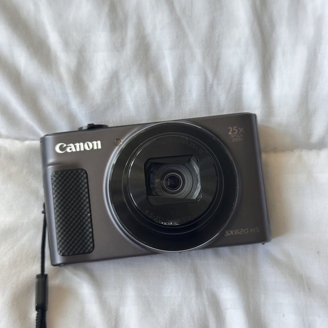 Canon PowerShot SX620 HS Digital Camera (Category: Cameras) located in Manila. Submitted by elaikaalm70490 (Listing ID 1436302378, Image 3). Description: - Canon PowerShot SX620 HS digital camera - 25x optical zoom - Includes: Canon battery charger, camera case, and wrist strap - Features a pop-up flash Issues: Lens not opening fully, but can manually open. Scratches seen on picture. Bought for 20,000 pesos.