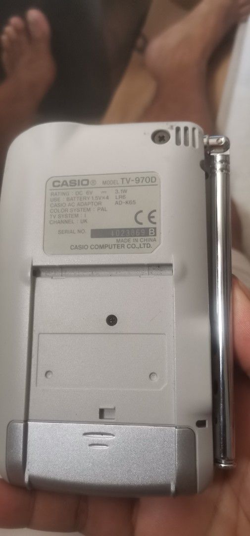 Casio TV-9700 LCD Color Television (Category: TV) located in Quezon City. Submitted by akosiahcap95300 (Listing ID 1436299384, Image 2). Description: - Casio TV-9700 LCD color television - Features a small LCD screen - Built-in antenna - Silver finish - Model: TV-9700 - Battery compartment at the back - Compact and portable.