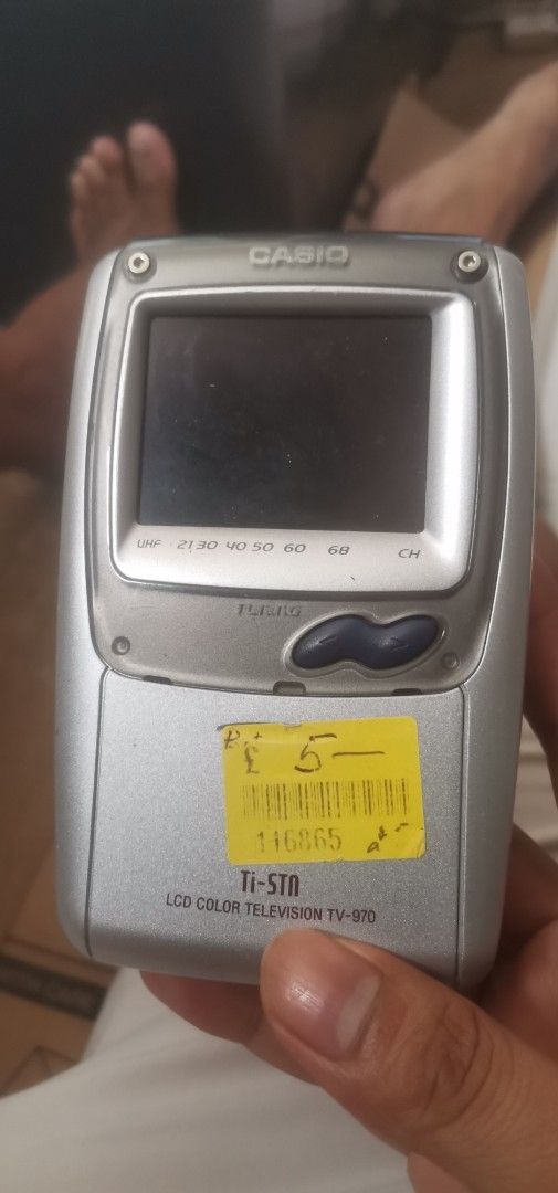 Casio TV-9700 LCD Color Television (Category: TV) located in Quezon City. Submitted by akosiahcap95300 (Listing ID 1436299384, Image 1). Description: - Casio TV-9700 LCD color television - Features a small LCD screen - Built-in antenna - Silver finish - Model: TV-9700 - Battery compartment at the back - Compact and portable.
