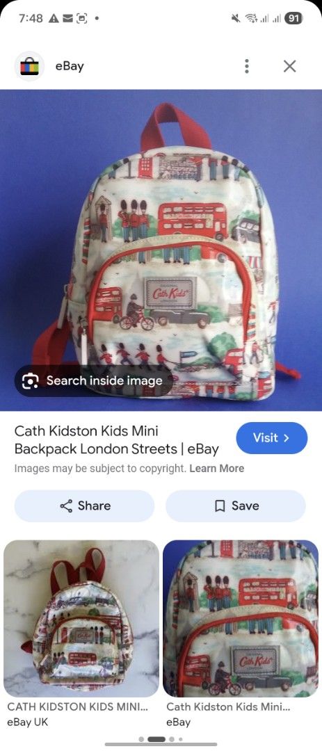 Cath Kidston Kids Mini Backpack London Streets (Category: Babies & Kids Fashion) located in Mandaue City. Submitted by chuchi152615 (Listing ID 1436469715, Image 3). Description: - Cath Kidston mini backpack - London Streets design - Red handle and straps - Front pocket - Main compartment - Zipper closure - Features illustrations of red double-decker buses, guards, and other London-themed elements - Includes Cath Kidston label.