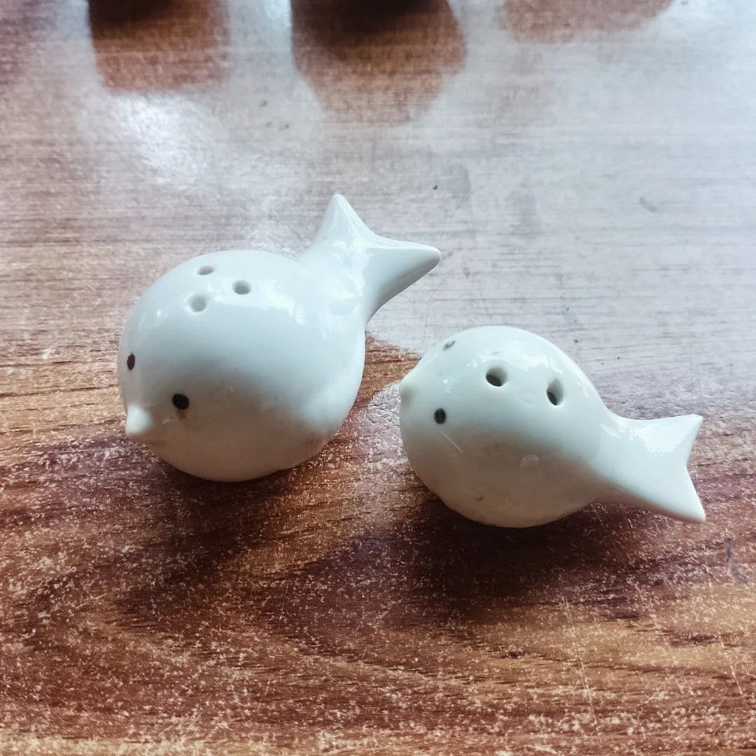 Ceramic Bird Salt and Pepper Shakers (Category: Food Organization & Storage) located in Baguio. Submitted by klutter.curio (Listing ID 1436470165, Image 1). Description: - Adorable bird-shaped salt and pepper shakers - Made of ceramic - Glossy white finish - Features black dot eyes - Designed with holes for dispensing - Easy to refill - Perfect for kitchen or dining table.
