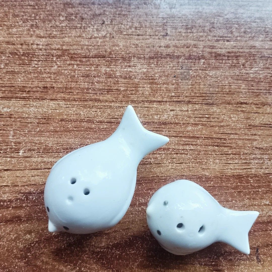 Ceramic Bird Salt and Pepper Shakers (Category: Food Organization & Storage) located in Baguio. Submitted by klutter.curio (Listing ID 1436470165, Image 2). Description: - Adorable bird-shaped salt and pepper shakers - Made of ceramic - Glossy white finish - Features black dot eyes - Designed with holes for dispensing - Easy to refill - Perfect for kitchen or dining table.