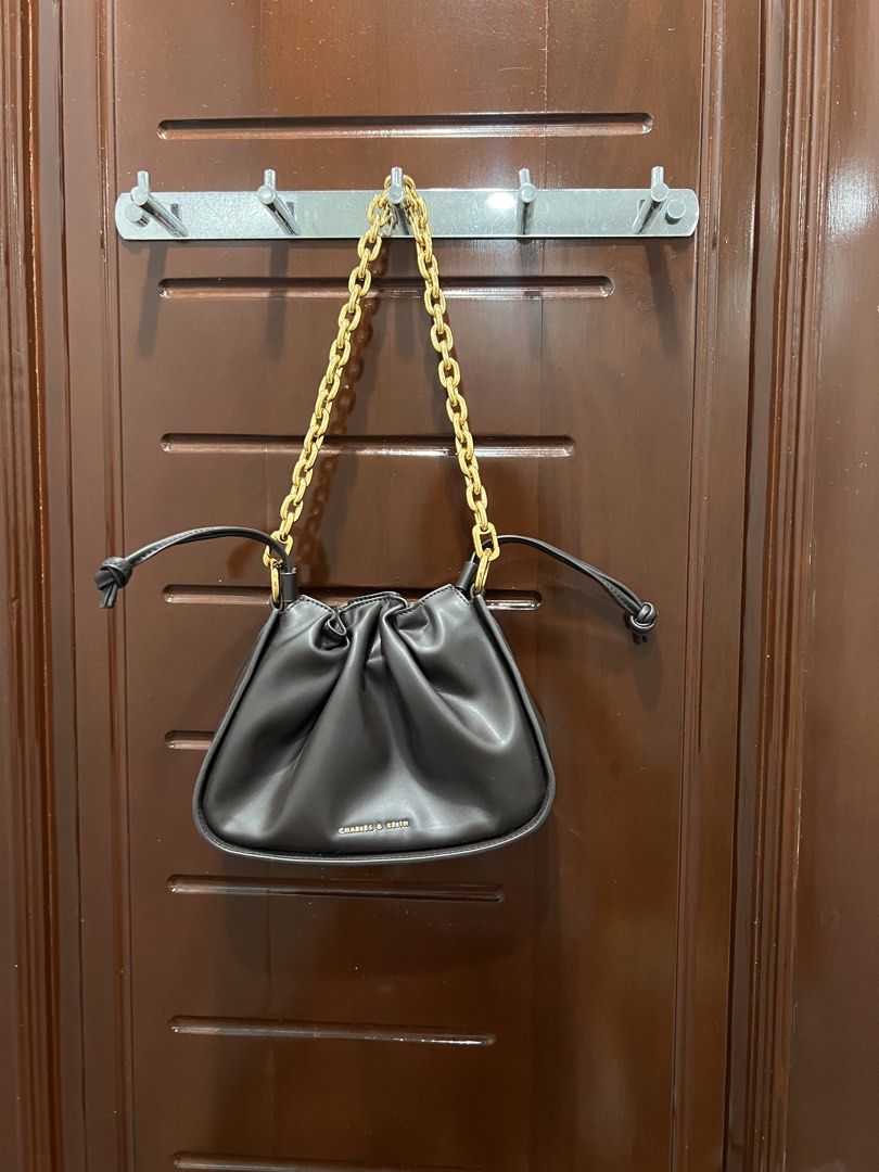 Charles & Keith Dark Brown Handbag (Category: Luxury Bags & Wallets) located in Manila. Submitted by limonee (Listing ID 1436394526, Image 3). Description: Has a few stains inside RFS: decluttering Loc: Tondo MOP: GCash, Maribank, Maya MOD: J&T, Lalamove, Grab.