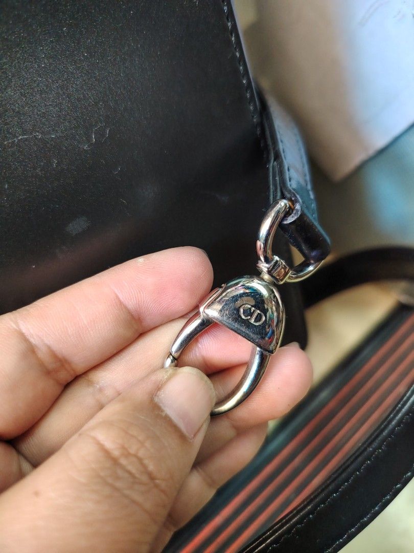 Christian Dior Lady Dior Handbag (Category: Luxury Bags & Wallets) located in Baguio. Submitted by bangtowanv91137 (Listing ID 1436380095, Image 3). Description: - Authentic Lady Dior handbag in black - Detachable shoulder strap included - Features silver-tone hardware - Adorned with iconic Dior charms - Interior includes a zipper closure - Features a "Christian Dior Paris" label.