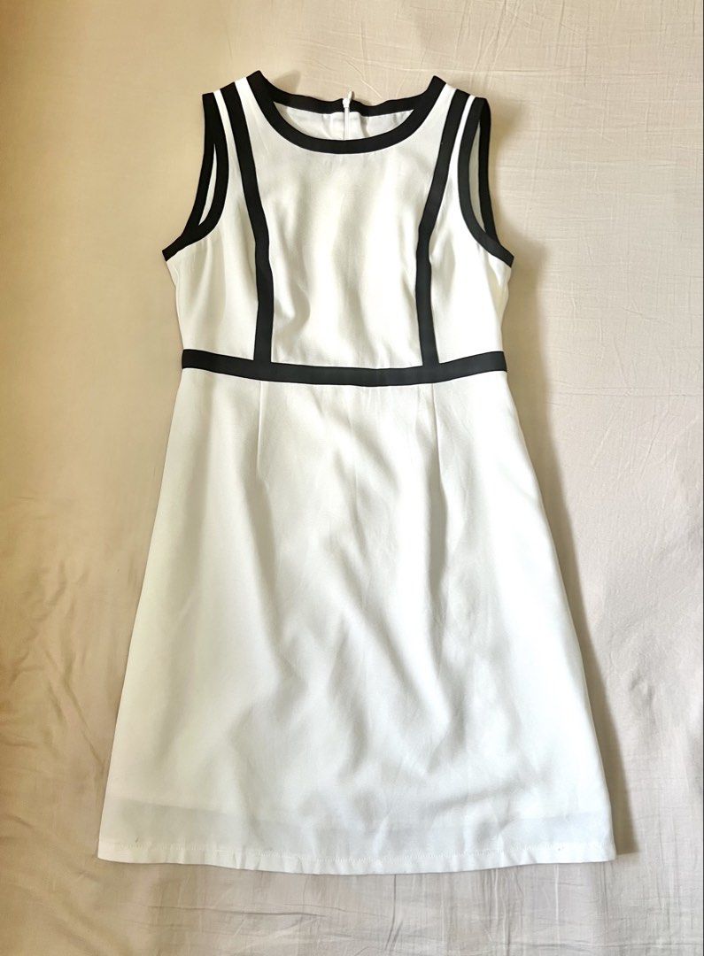 Classic Monochrome Chic: The Ultimate Preloved Shift Dress (Category: Dresses) located in Mandaluyong City. Submitted by urgifted (Listing ID 1436321325, Image 3). Description: Elevate your wardrobe with this timeless Black & White Shift Dress. Why You’ll Love It: • Contouring Detail: The strategic black piping creates a slimming, architectural effect that flatters your frame. • Versatile Design: Features a classic round neckline and a sleek slee