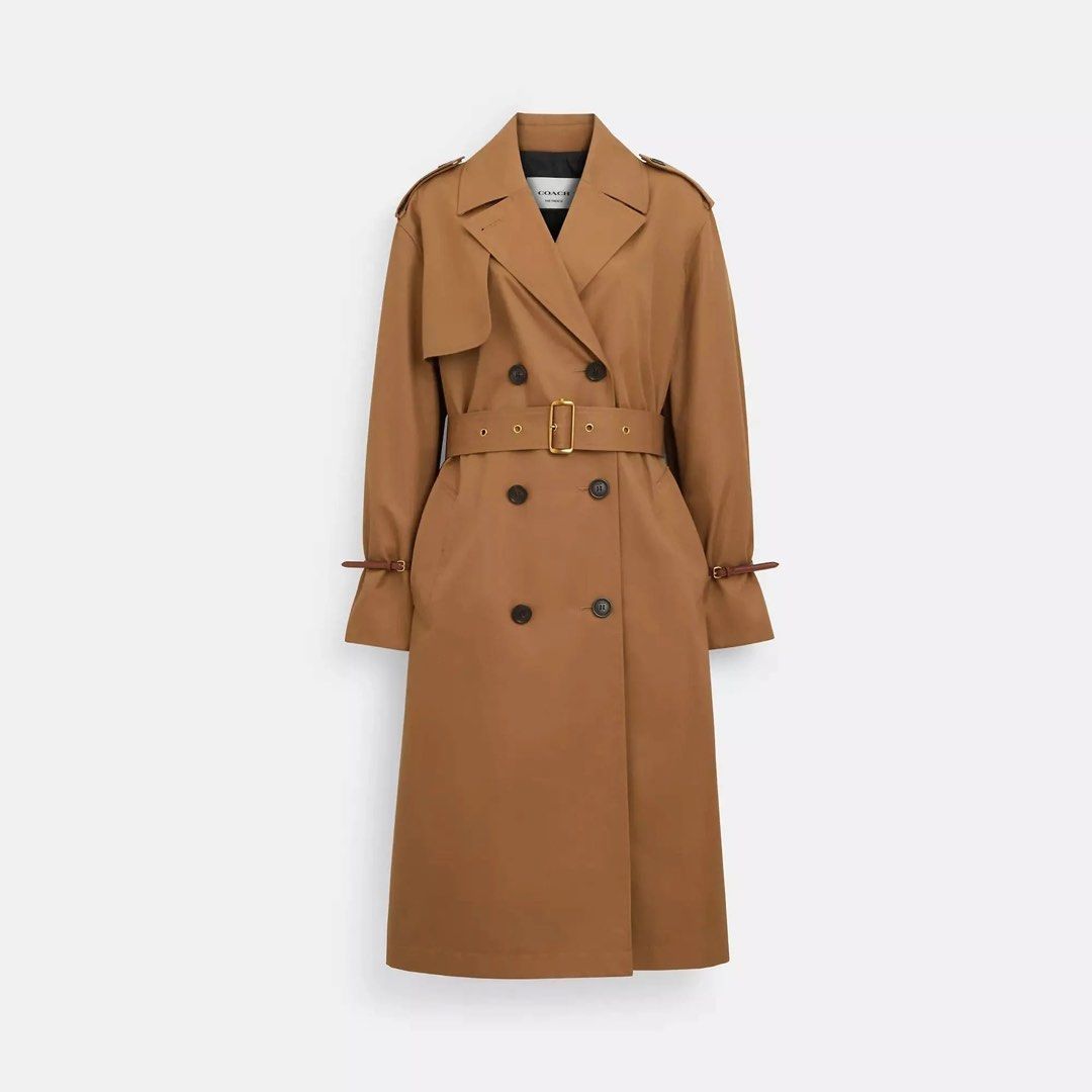Coach Relaxed Double Breasted Trench Coat (Category: Coats, Jackets and Outerwear) located in Pasig City. Submitted by daslimited (Listing ID 1436301527, Image 1). Description: - Coach trench coat - Double-breasted design - Includes a belt - Classic trench coat style - Dark khaki color - Relaxed fit - Suitable for various occasions Originally priced at C$850 and purchased on sale for C$336 (tax included). Now offered at a very low price. Just nee