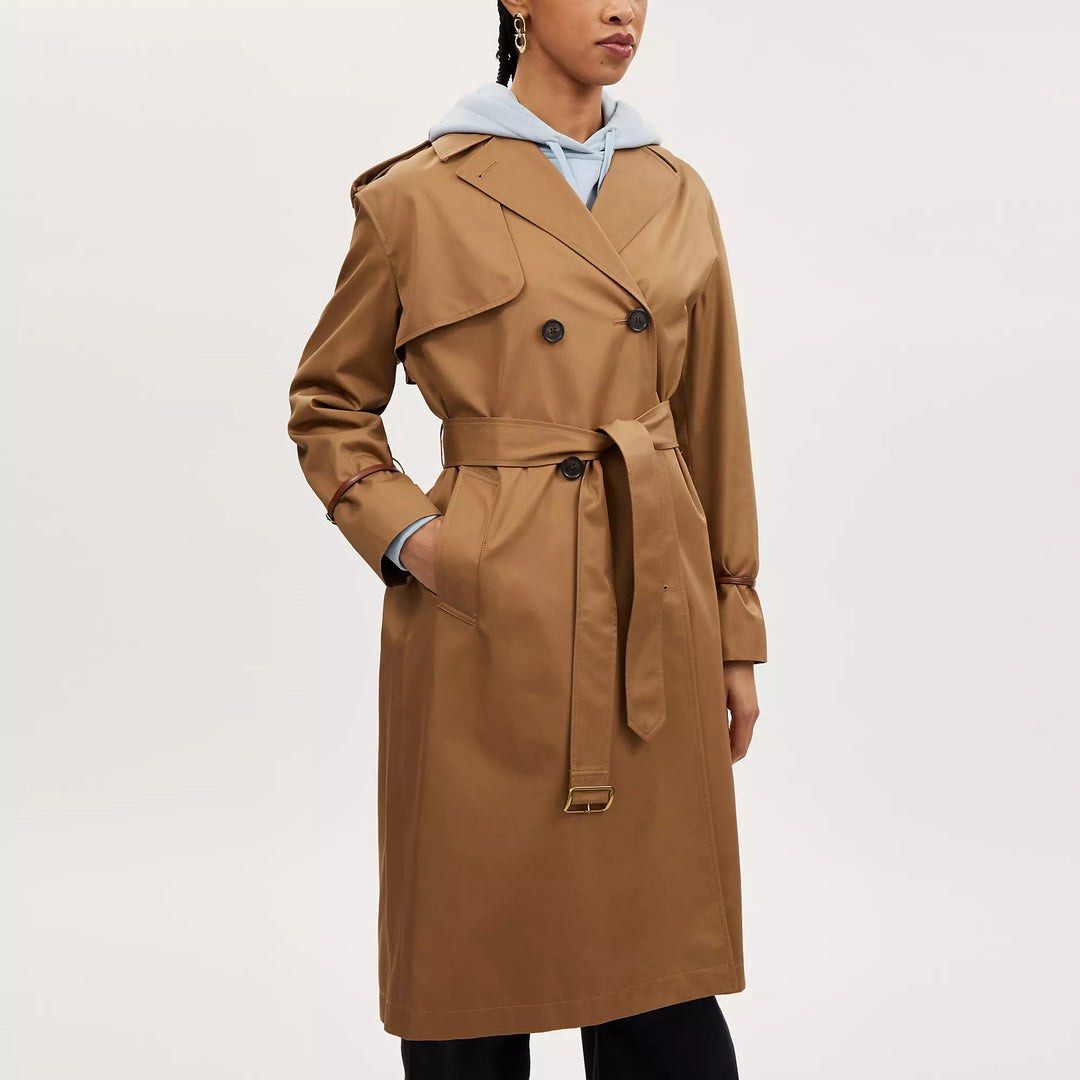 Coach Relaxed Double Breasted Trench Coat (Category: Coats, Jackets and Outerwear) located in Pasig City. Submitted by daslimited (Listing ID 1436301527, Image 3). Description: - Coach trench coat - Double-breasted design - Includes a belt - Classic trench coat style - Dark khaki color - Relaxed fit - Suitable for various occasions Originally priced at C$850 and purchased on sale for C$336 (tax included). Now offered at a very low price. Just nee