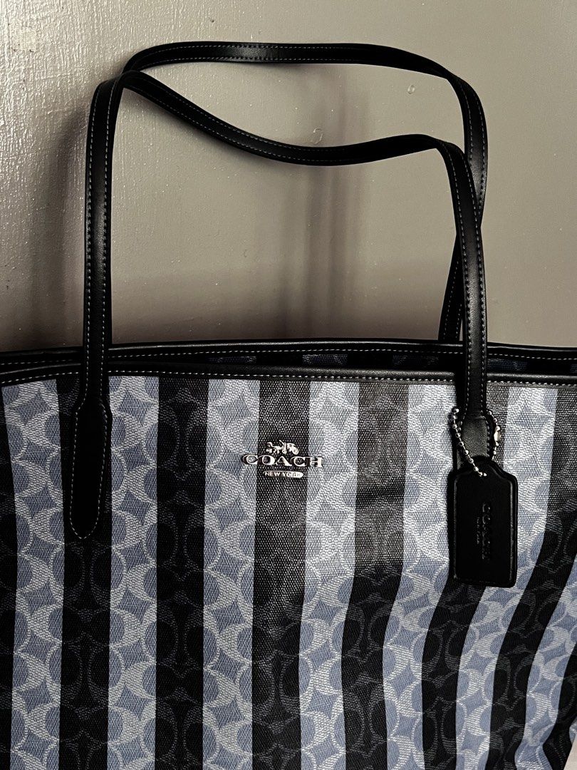 RUSH Coach Striped City Tote Bag (Category: Tote Bags) located in Taytay. Submitted by zdeclut (Listing ID 1436378774, Image 2). Description: - Coach City authentic from coach outlet direct US store - Light blue and black striped pattern with Coach logo - Black leather handles and trim - Zip closure - Interior pocket - Includes Coach tag and care card .