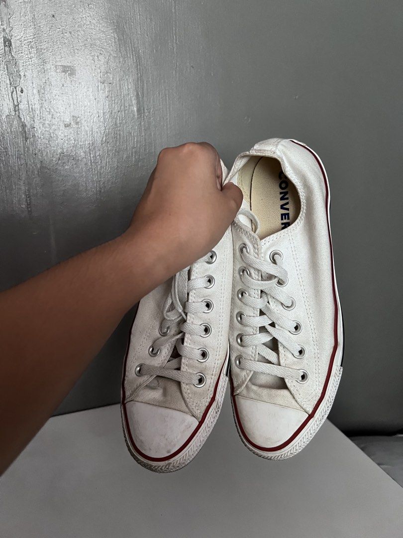 Converse Chuck Taylor All Star White Sneakers (Category: Sneakers) located in Taytay. Submitted by zdeclut (Listing ID 1436376654, Image 2). Description: - Classic white Converse Chuck Taylor All Star sneakers - Bought from Korea - condition 9/10 - used 2 times only indoor - Size: 8.5 - Features iconic Converse logo - White upper with red and black sole stripe - Includes original box - Laced up and ready to wear.