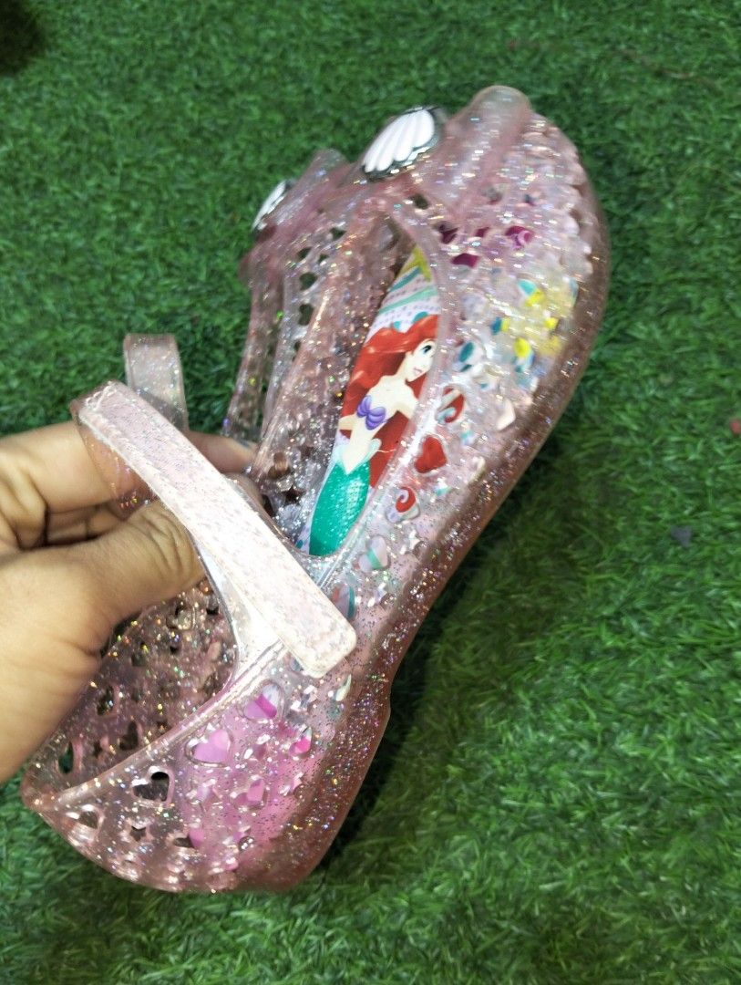 Disney Ariel Sandals Size 19.0 (Category: Babies & Kids Fashion) located in General Santos City (Dadiangas). Submitted by ukayonlineshoppe (Listing ID 1436313282, Image 3). Description: - Adorable pink sandals featuring Ariel from The Little Mermaid. - Size: 19.0 - Glittery finish. - Easy-wear strap. - Soles show wear, but Ariel design is vibrant. - Perfect for little princesses!.