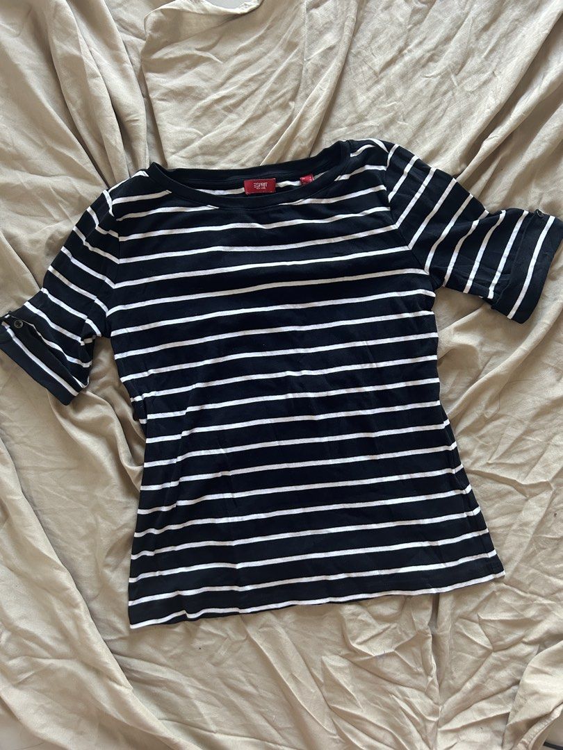 Esprit New York Striped Top (Category: Blouses) located in Binan City. Submitted by missrandomthings (Listing ID 1436363286, Image 1). Description: - Esprit New York top - Classic black and white stripes - Short sleeves with button accents - Round neckline - Comfortable, everyday wear fabric - Features the Esprit New York logo.