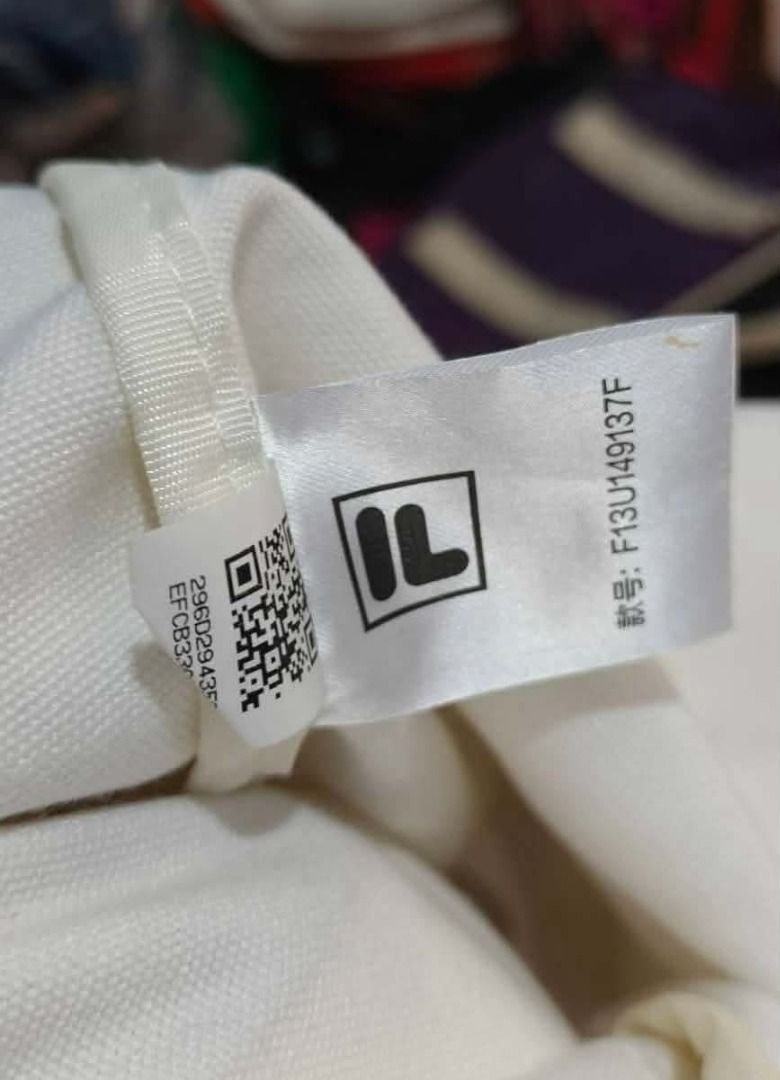 FILA X HAVE A GOOD TIME TOTEBAG (Category: Tote Bags) located in Maragusan (San Mariano). Submitted by kaldmark27 (Listing ID 1436300189, Image 2). Description: - FILA X HAVE A GOOD TIME tote bag - White color - Features "Have a Good Time" graphic - FILA logo present - Stylish and functional.