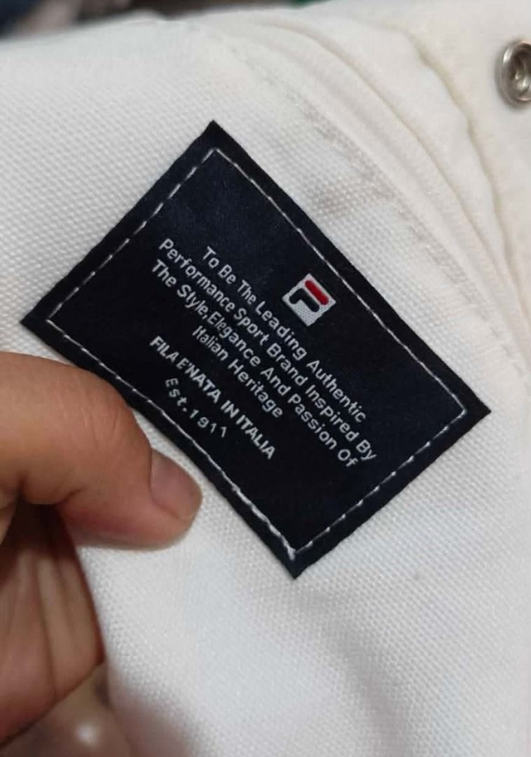 FILA X HAVE A GOOD TIME TOTEBAG (Category: Tote Bags) located in Maragusan (San Mariano). Submitted by kaldmark27 (Listing ID 1436300189, Image 3). Description: - FILA X HAVE A GOOD TIME tote bag - White color - Features "Have a Good Time" graphic - FILA logo present - Stylish and functional.