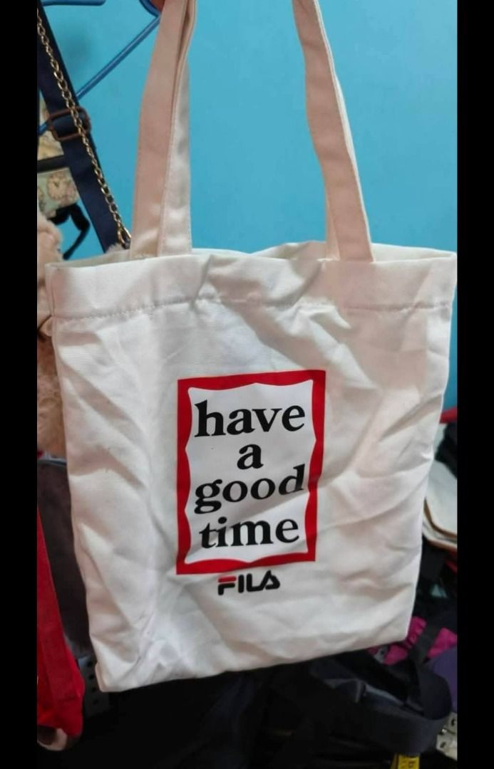 FILA X HAVE A GOOD TIME TOTEBAG (Category: Tote Bags) located in Maragusan (San Mariano). Submitted by kaldmark27 (Listing ID 1436300189, Image 1). Description: - FILA X HAVE A GOOD TIME tote bag - White color - Features "Have a Good Time" graphic - FILA logo present - Stylish and functional.