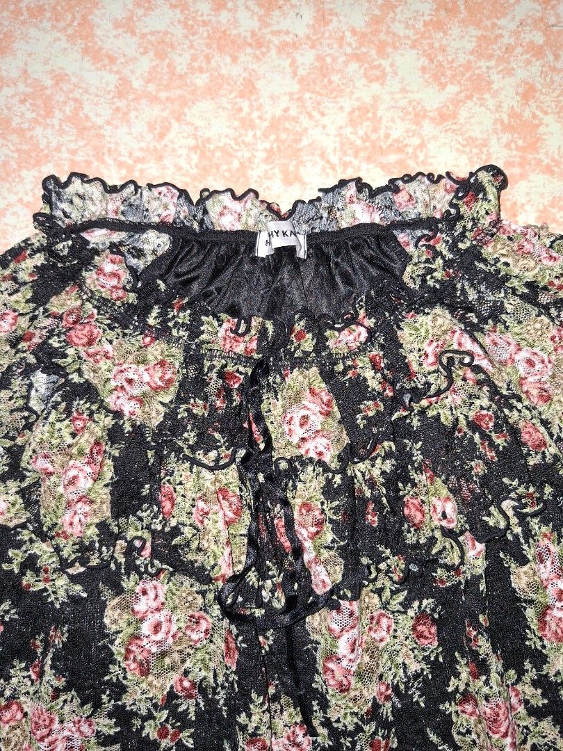 Floral Blouse with Ruffle Details (Category: Blouses) located in Valenzuela. Submitted by thriftlets (Listing ID 1436325593, Image 2). Description: - Floral patterned blouse - Long sleeves - Ruffled neckline and sleeve cuffs - Sheer fabric.